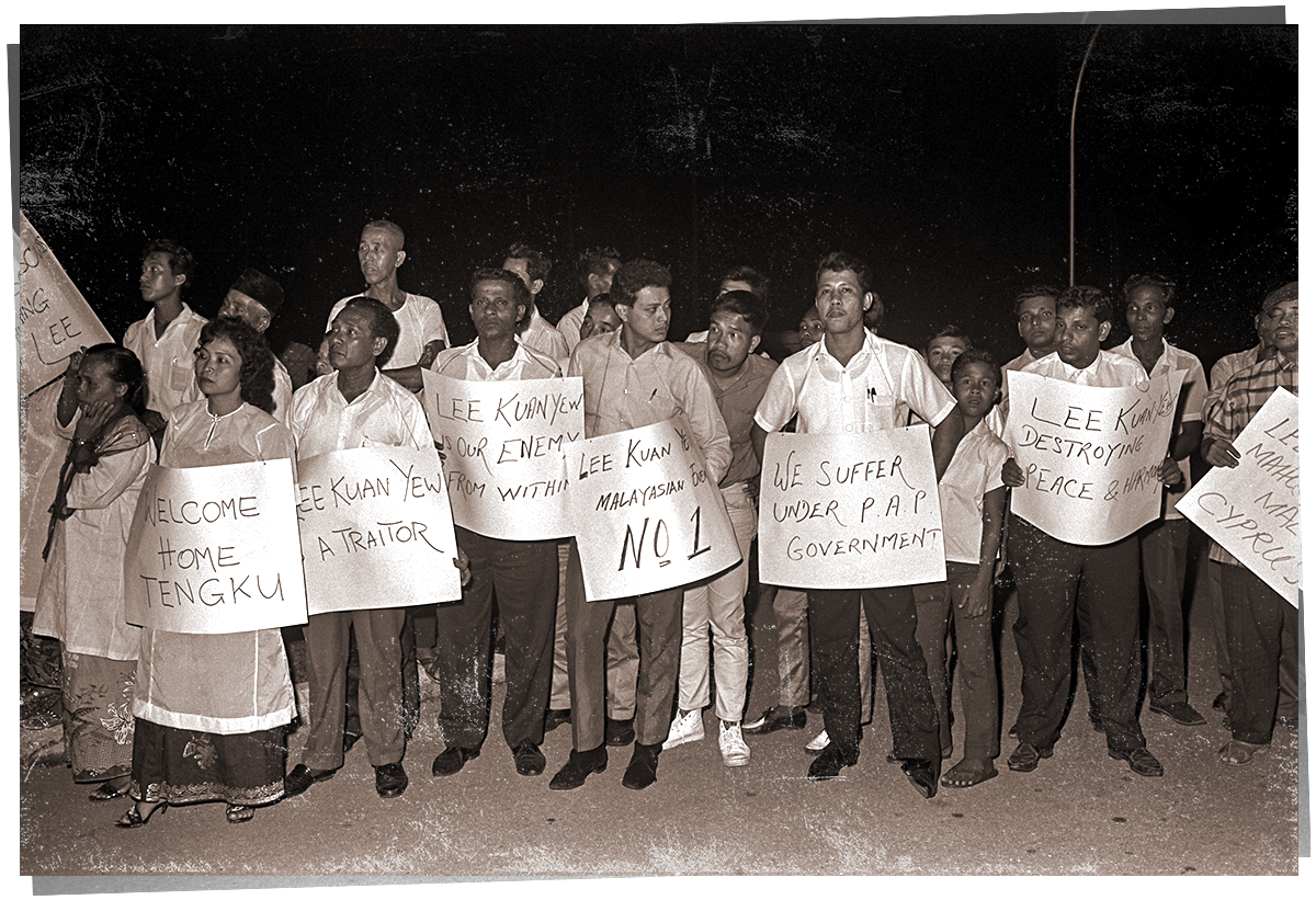 People seen carrying anti-Lee Kuan Yew and anti-PAP placards.