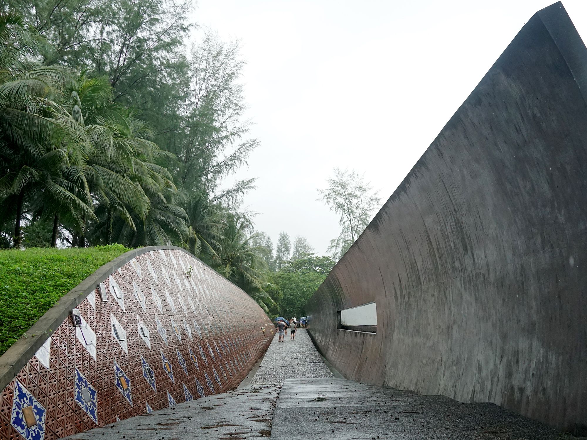 A wave-shaped monument that pays tribute to the locals and tourists who died during the 2004 tsunami in Khao Lak, Thailand.